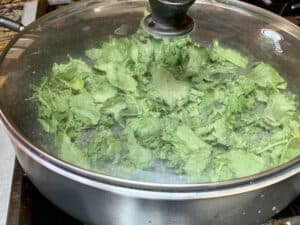 turnip greens cooking in pot