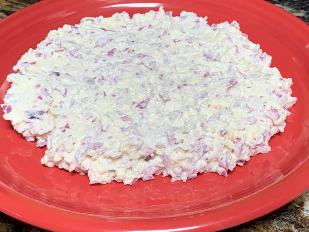 shape white cheddar and red onion dip before refrigerating
